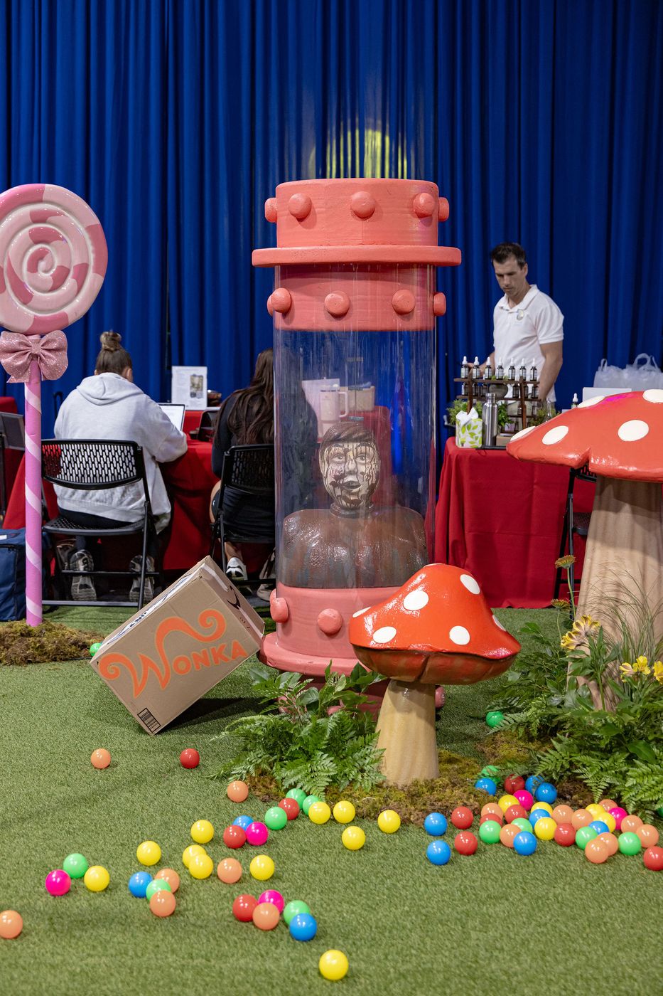 An oversized chocolate bar and top hat at the centre of a themed event build