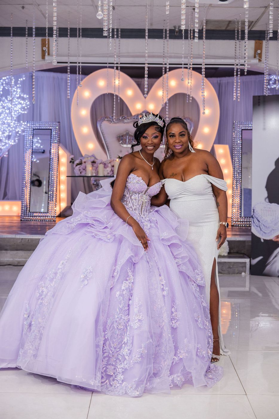 A sweet sixteen portrait in front of the marquee heart