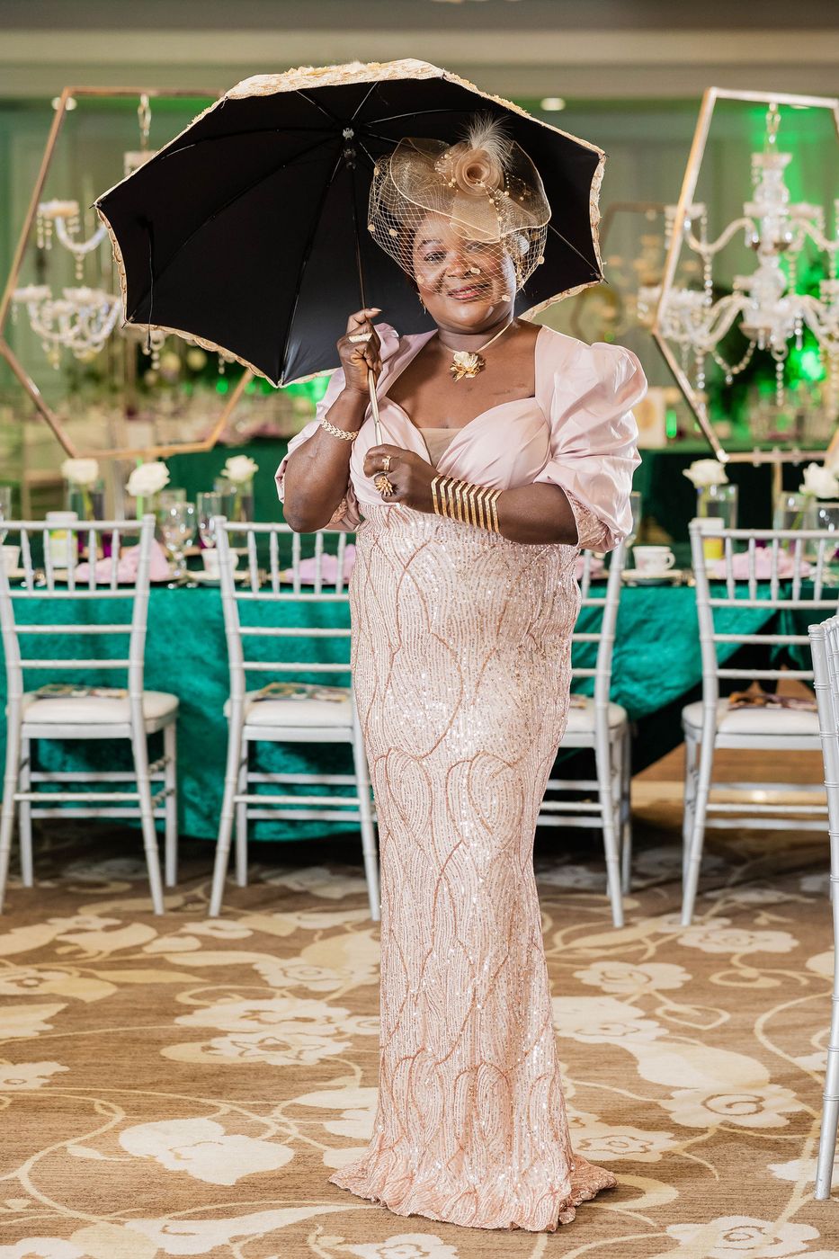 A guest in period costume with a lace parasol at a Regency themed ball