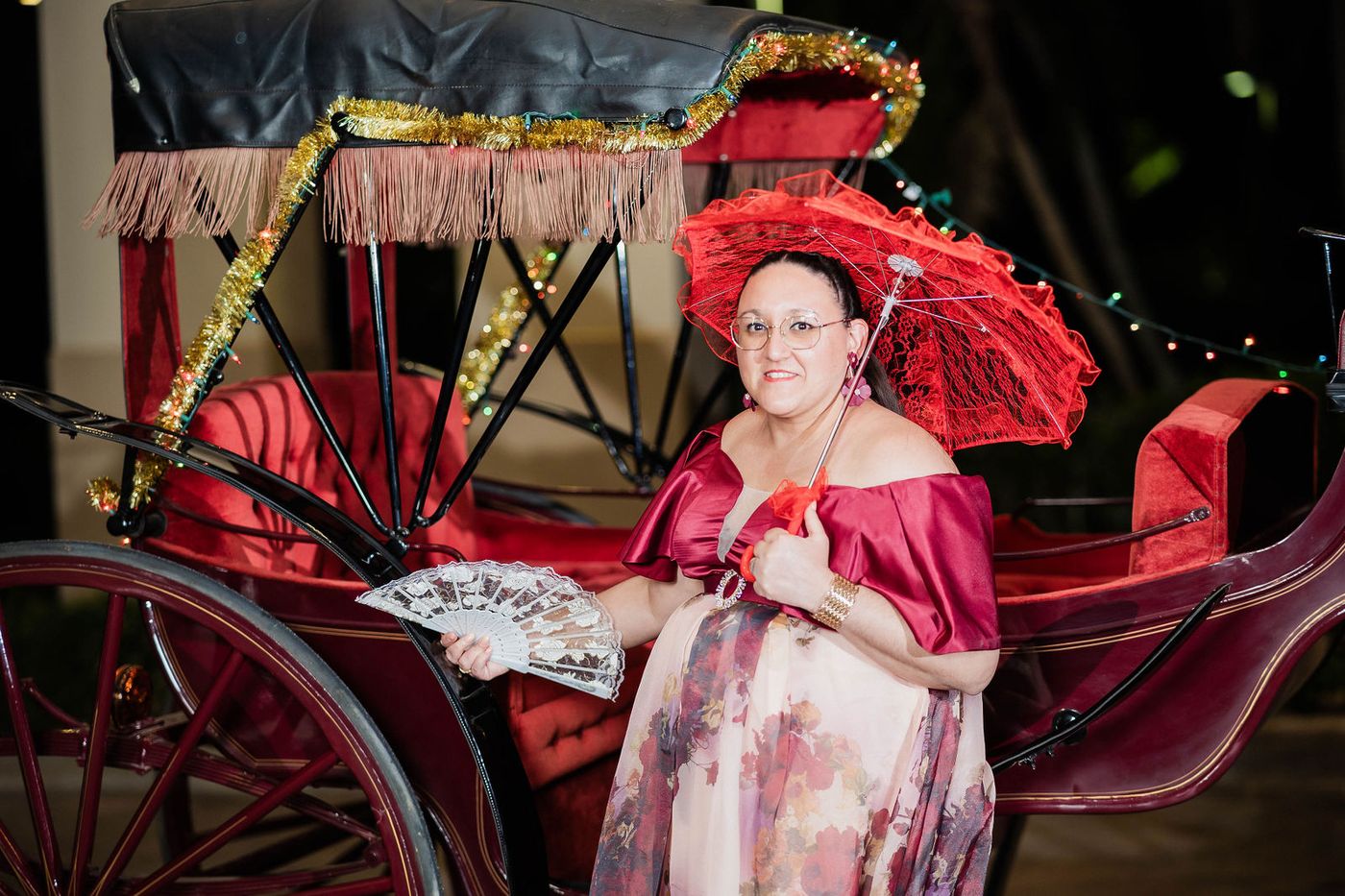 A horse drawn carriage brought inside for guests arriving at a themed ball