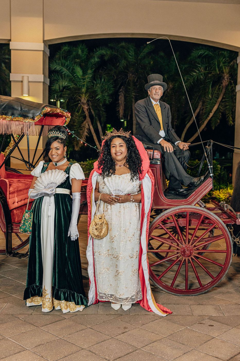 A guest photographed in period dress beside the carriage