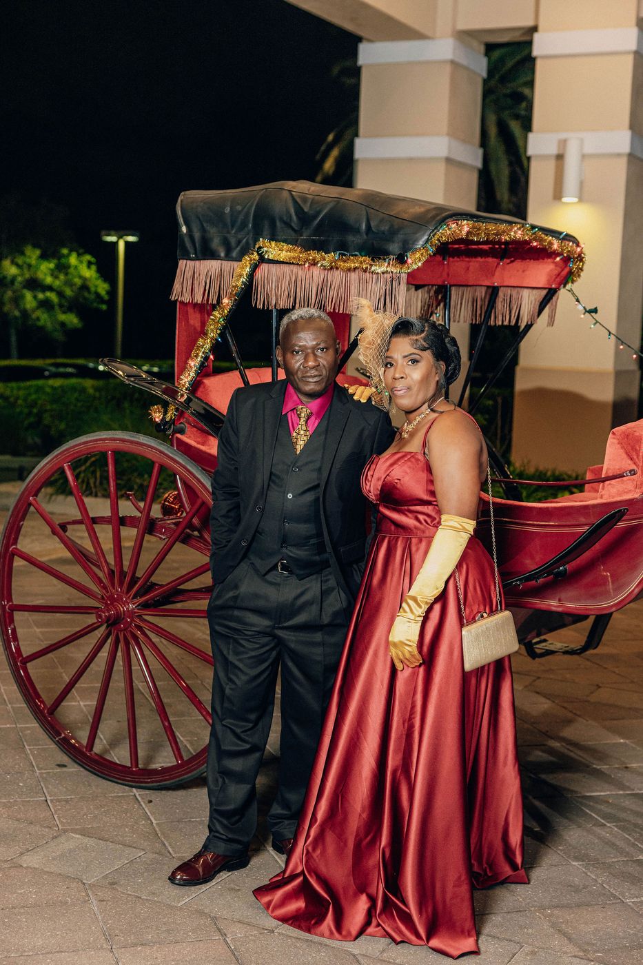 A couple photographed with the carriage at the close of a themed ball
