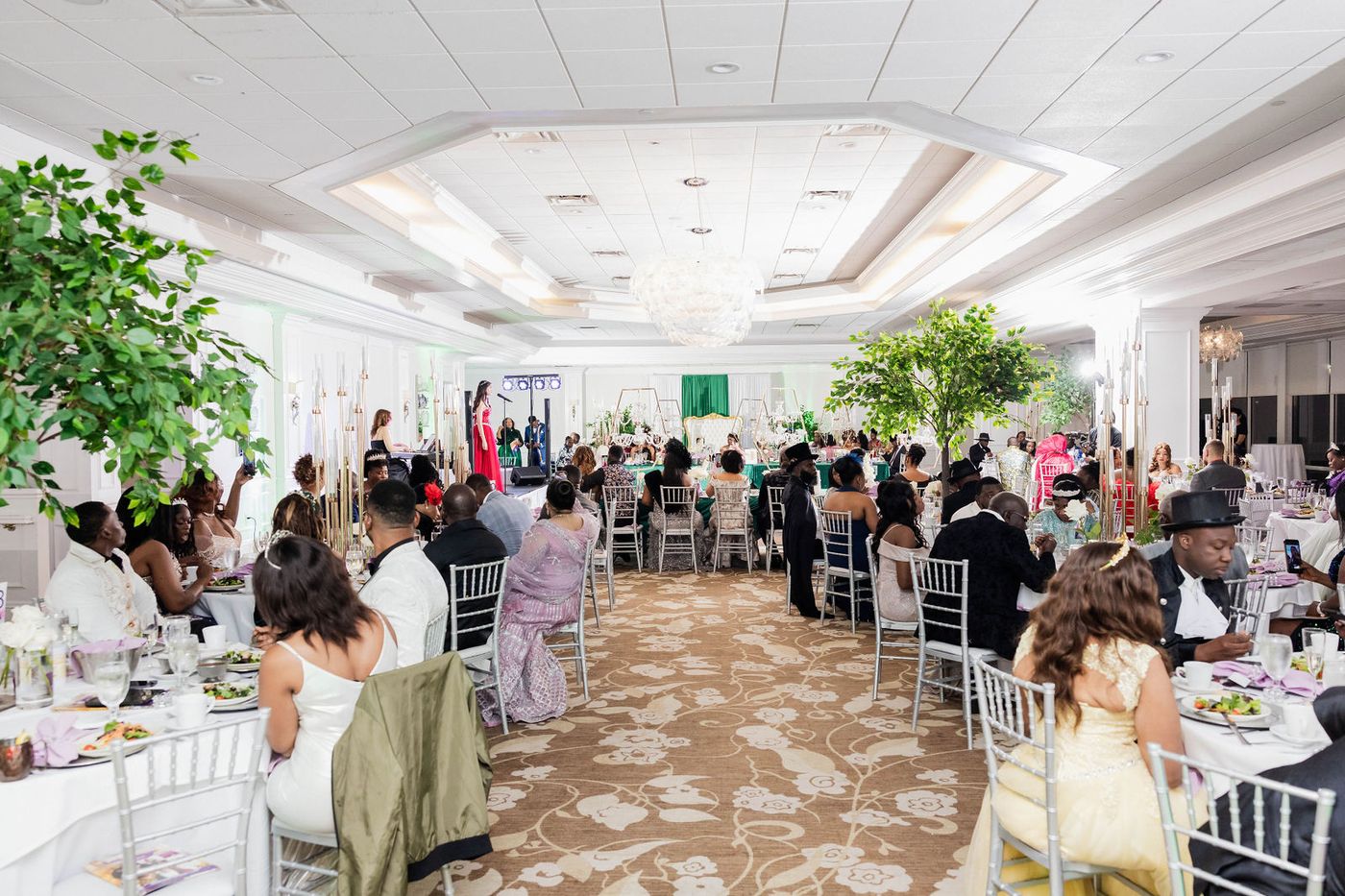 The full ballroom of a Regency themed ball during dinner service