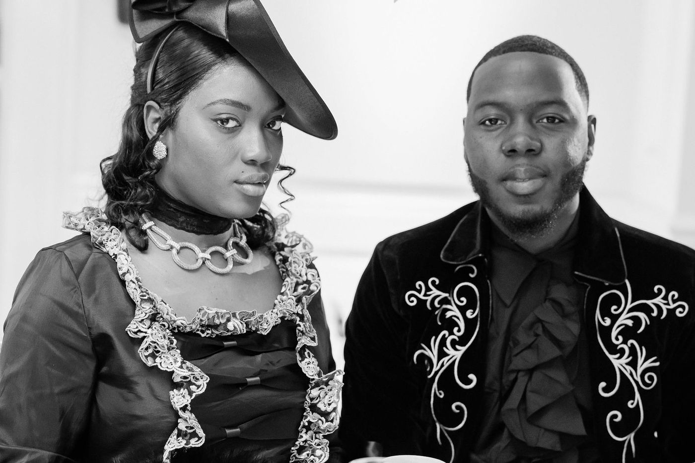 A black and white portrait of a couple in period costume