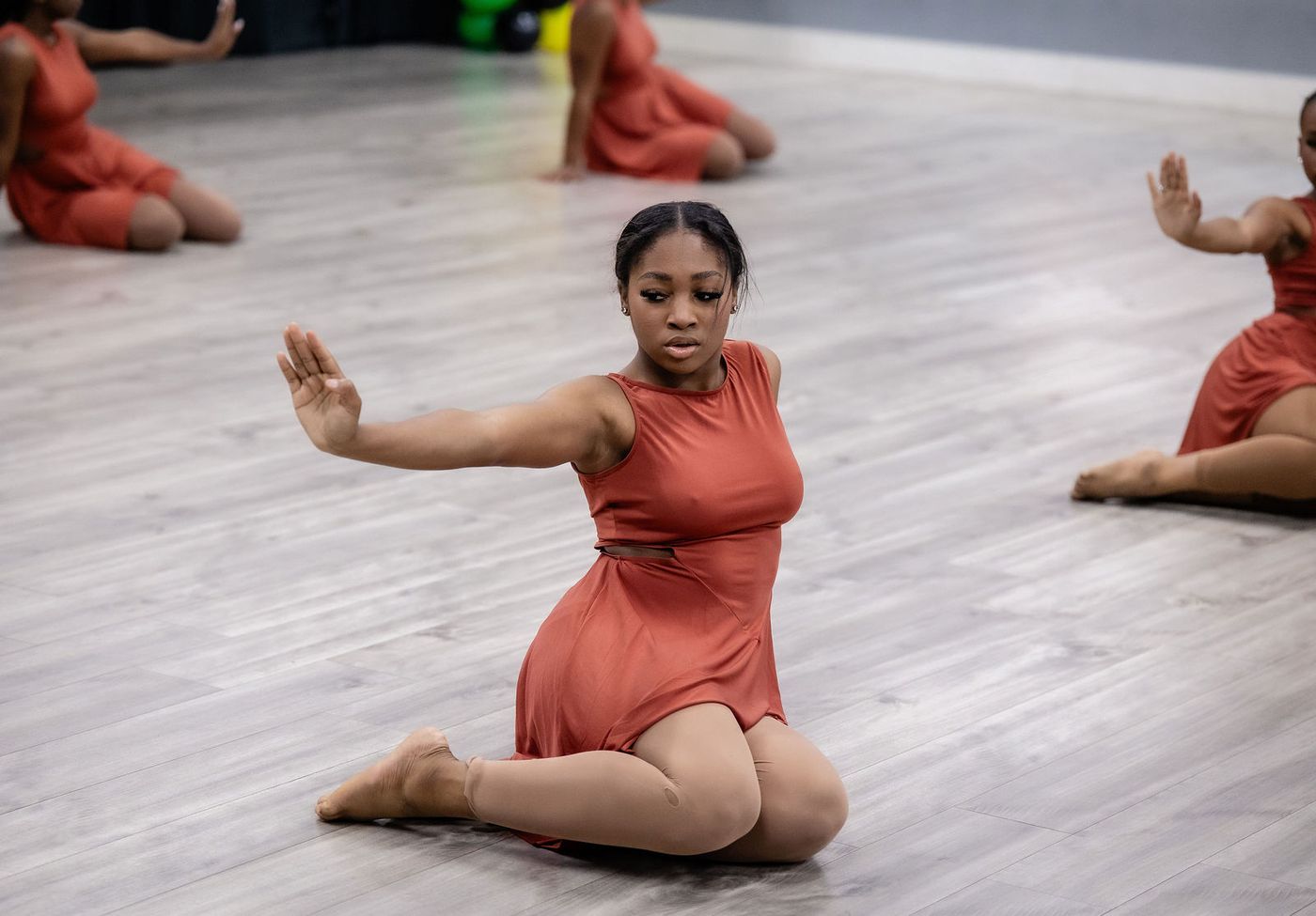 A soloist on the floor during a studio dance showcase
