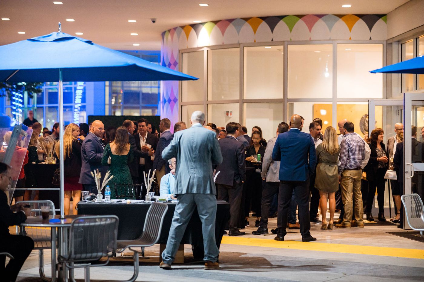The reception of an end-of-year industry mixer filling up at a South Florida venue