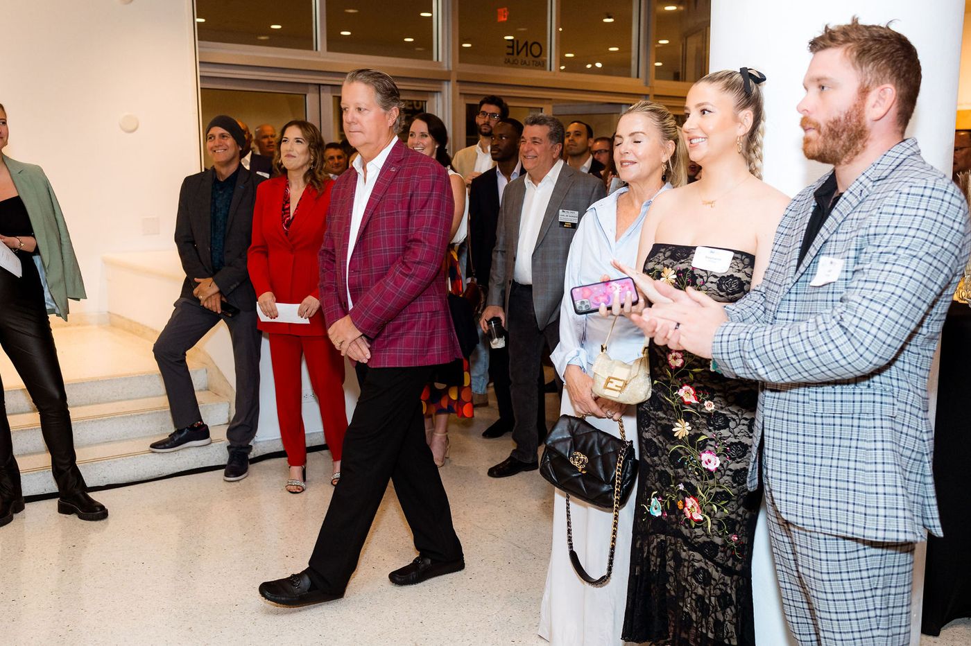 Guests talking over drinks at an industry association reception