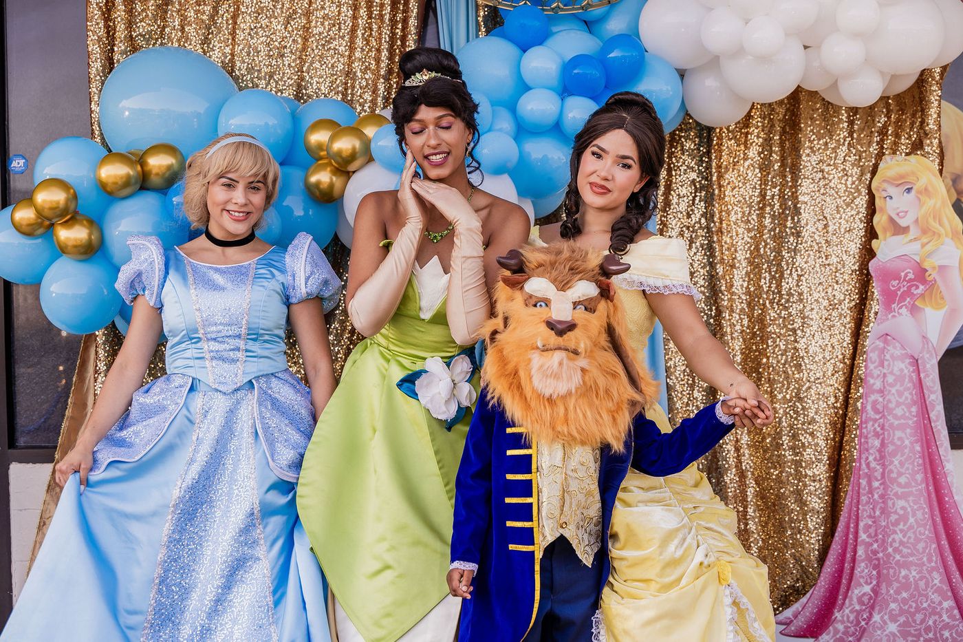 Costumed characters posing together at a children's prom night