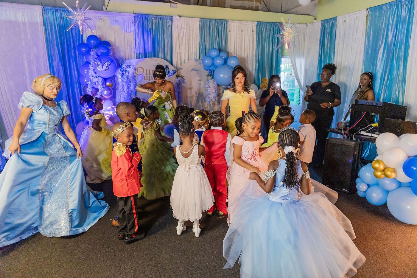 The dance floor of a children's prom night, characters and guests together