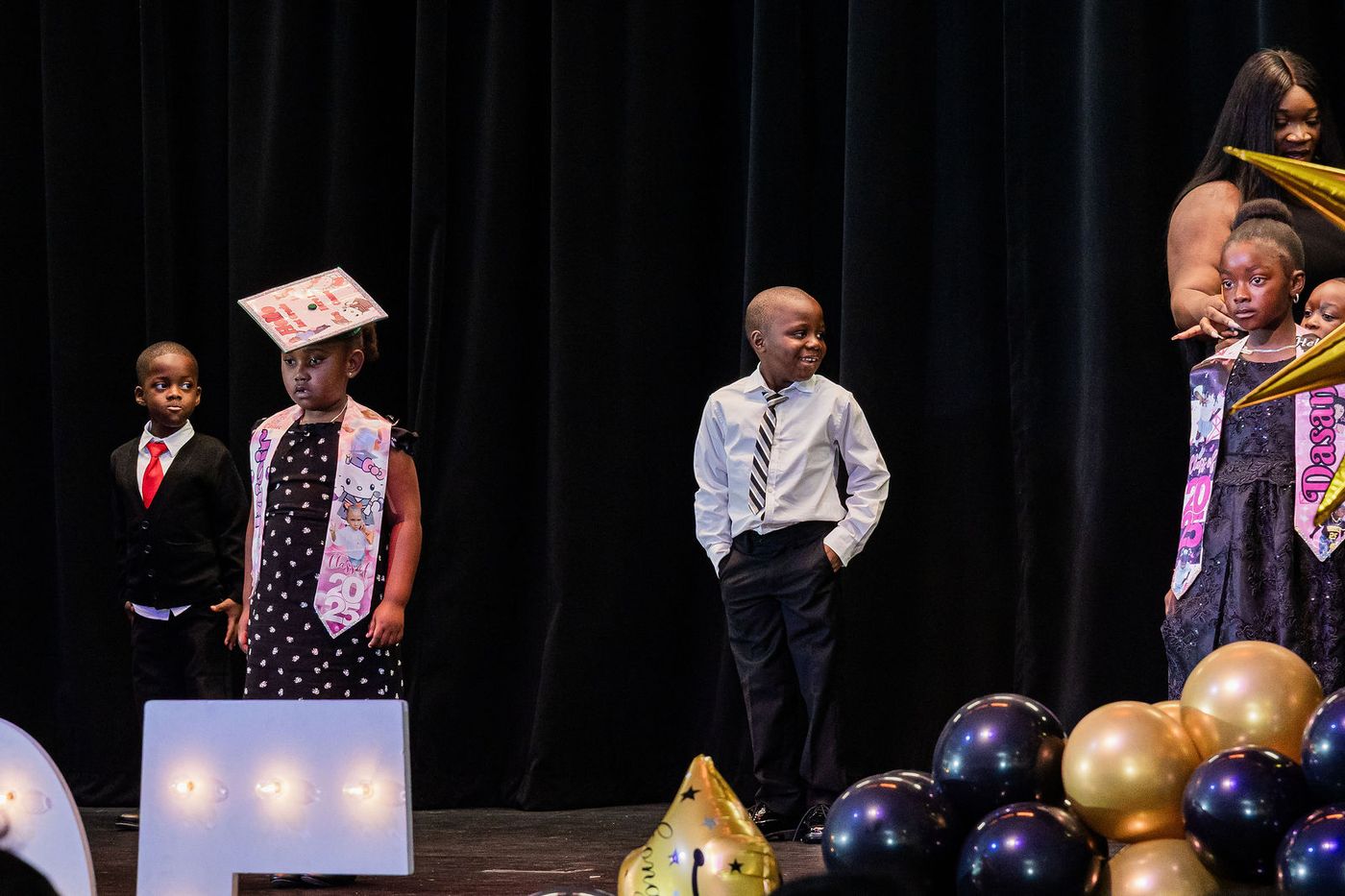 Two young graduates on stage during the ceremony