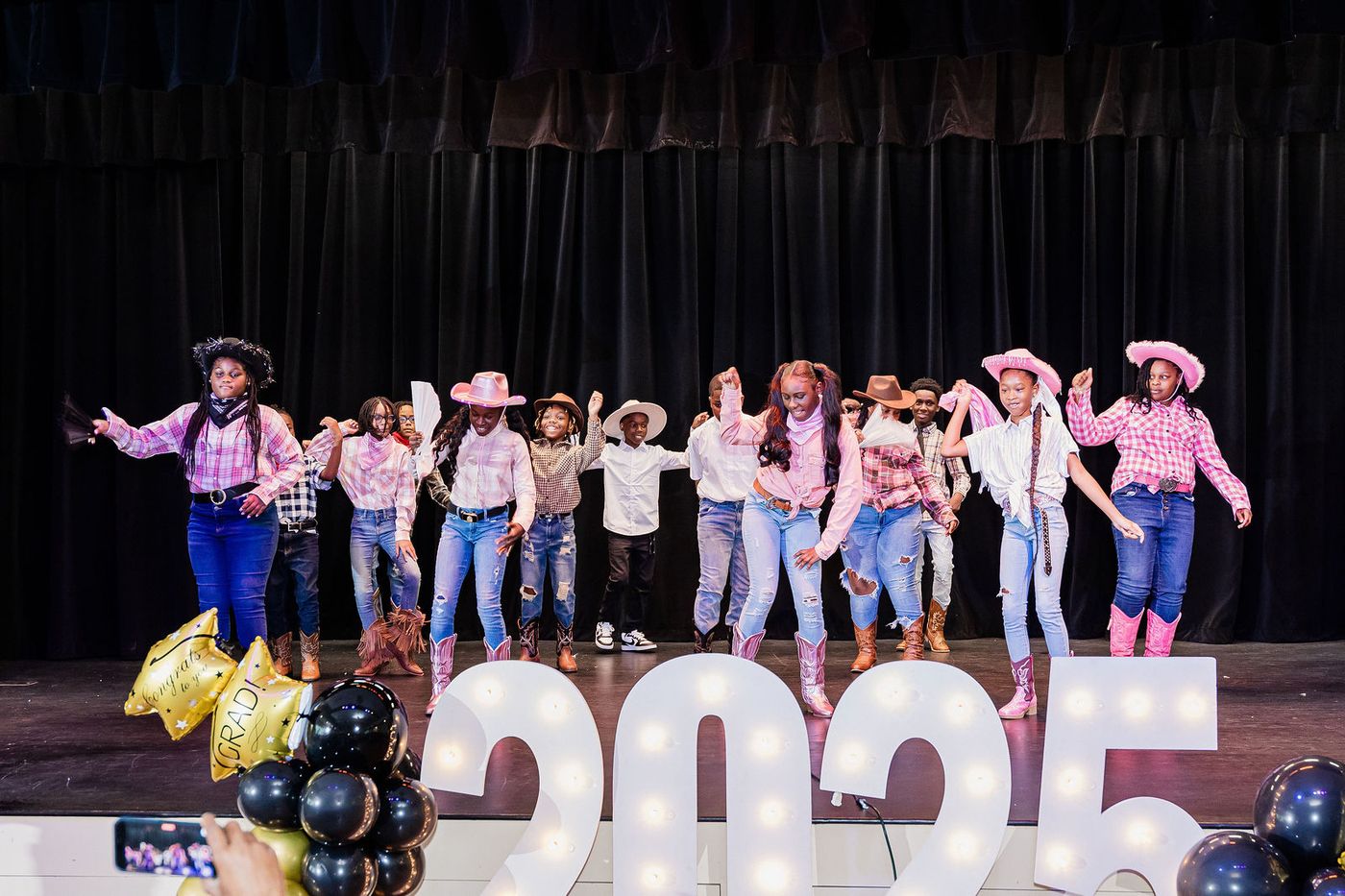 A themed class performance during a graduation programme