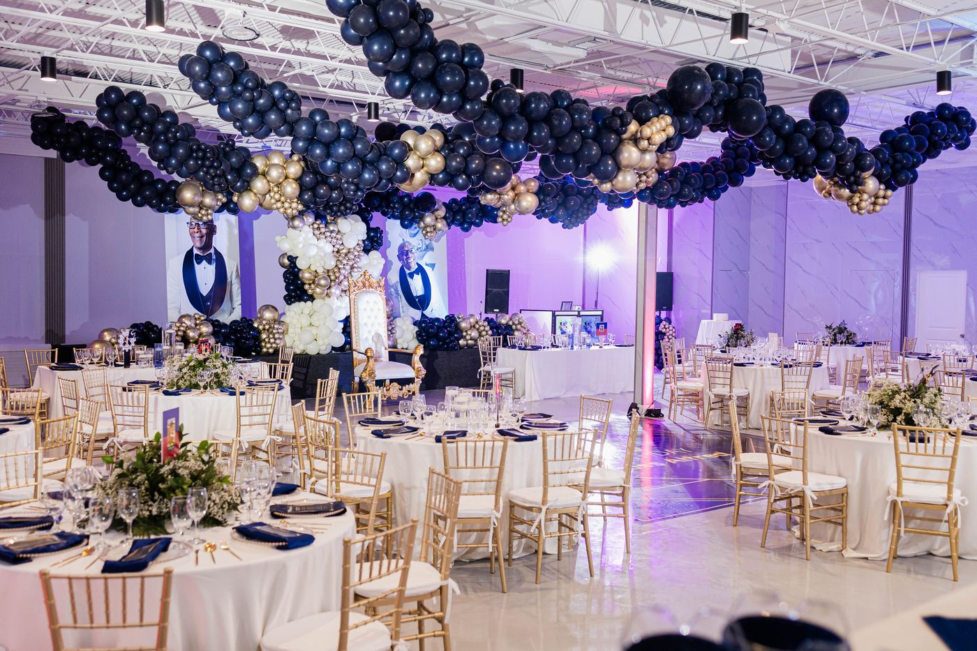 The ballroom uplit and laid, before the doors open