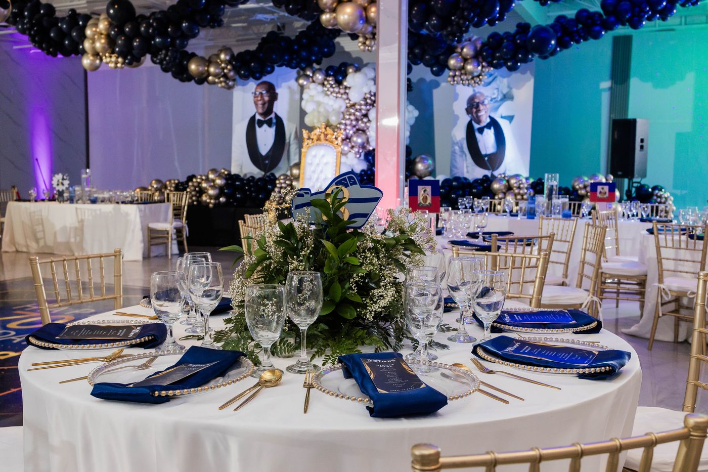 A place setting in navy and gold at a milestone birthday