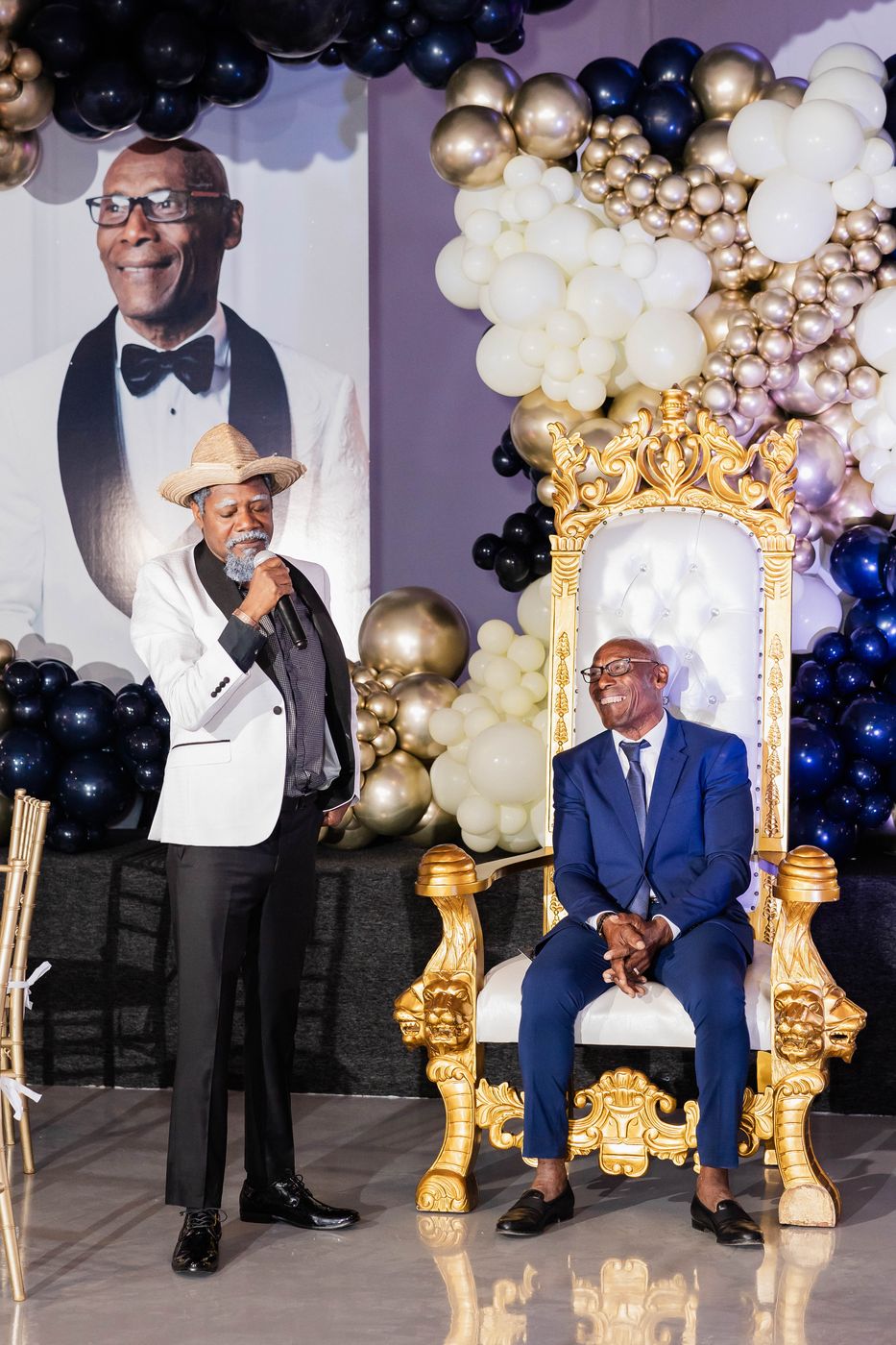 The gilded thrones and balloon installation at a 70th birthday