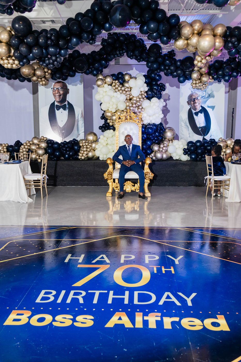 The guest of honour standing on his own monogrammed dance floor