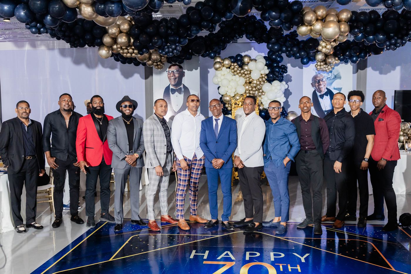 The whole party gathered on the dance floor at a 70th birthday