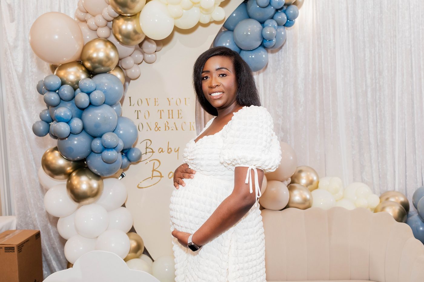 The mother-to-be photographed at the balloon arch