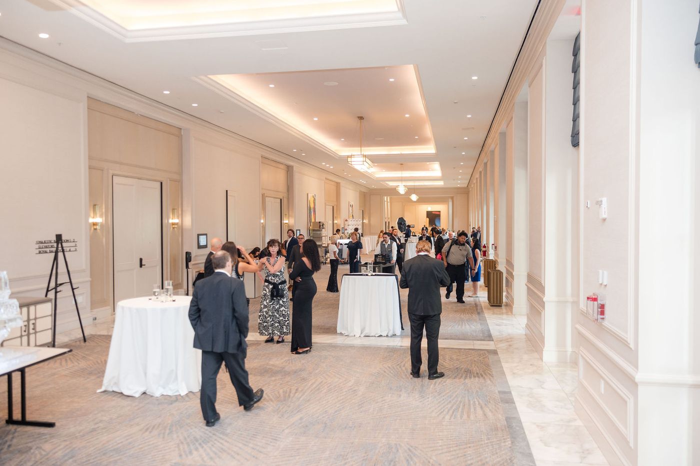 The reception corridor of a hotel ballroom before an awards banquet
