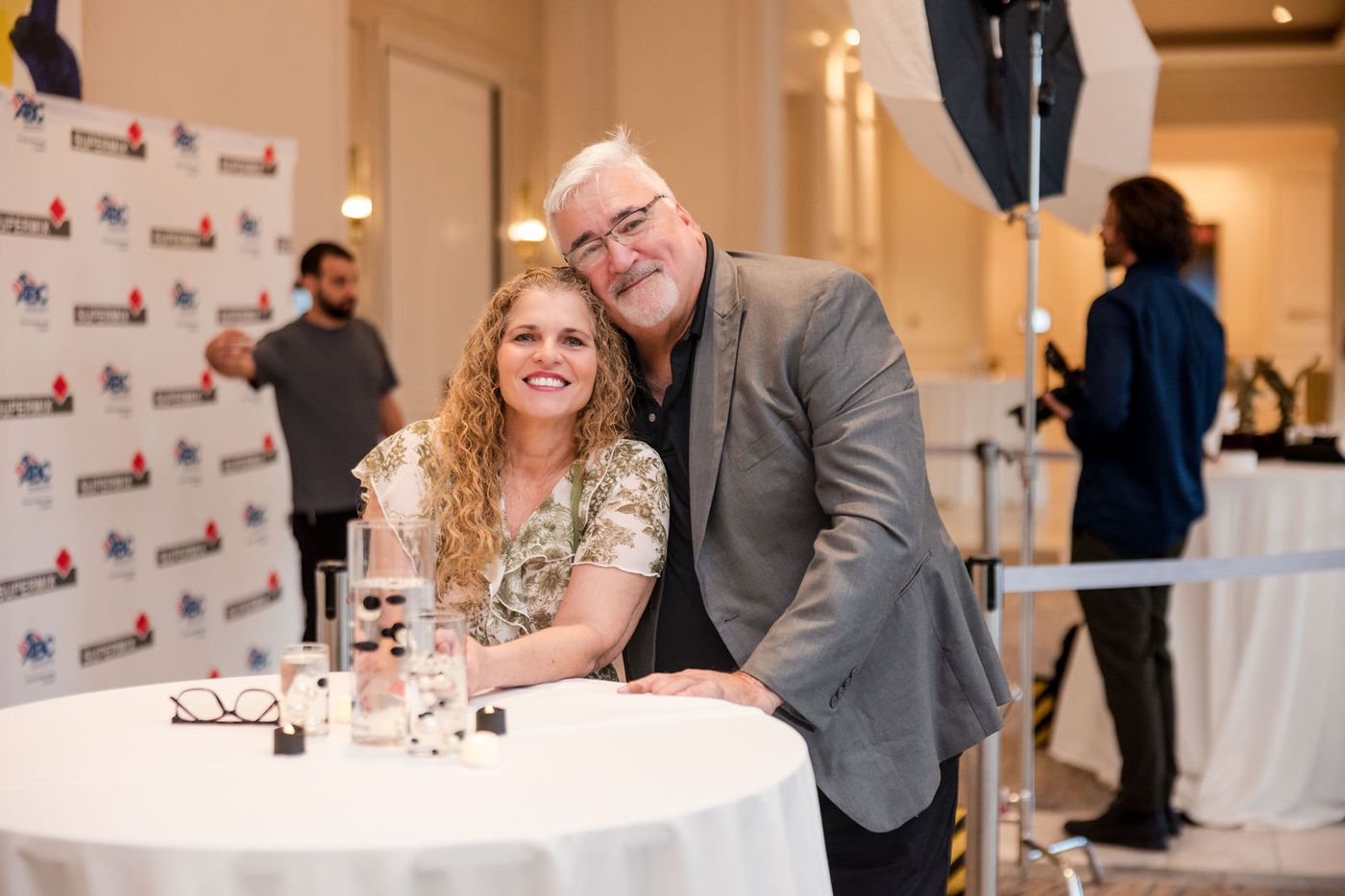 Guests photographed at the branded step and repeat of a construction industry gala