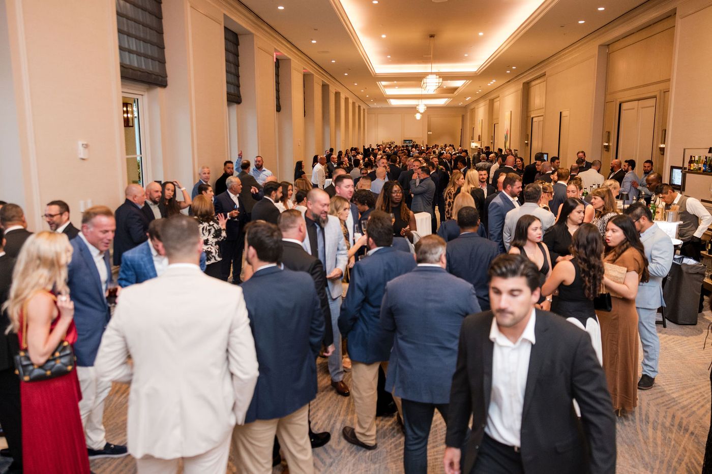 The reception of an awards gala filling with several hundred guests